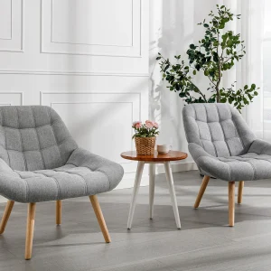 Fauteuil van grijze stof in Scandinavische stijl met capitonnage LUOSTO