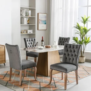 Grijze fluwelen eetkamerstoel met koperen studs, poten van massief hout, modern design, hoogte 95 cm (4 stuks) Grijze fluwelen eetkamerstoel met koperen studs, poten van massief hout, modern design, hoogte 95 cm (4 stuks)