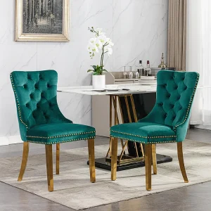 Gestoffeerde eetkamerstoel in 2 delen met poten van verchroomd roestvrij staal, spijkerkopafwerking, fluwelen bekleding, groen Gestoffeerde eetkamerstoel in 2 delen met poten van verchroomd roestvrij staal, spijkerkopafwerking, fluwelen bekleding, groen