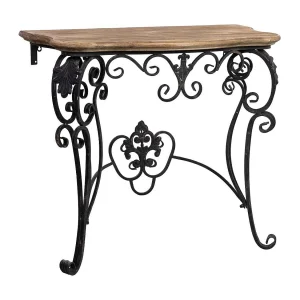 Haltafel van hout en metaal met een verouderde zwarte afwerking. Haltafel van hout en metaal met een verouderde zwarte afwerking.